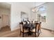 Light-filled dining room featuring a chandelier, luxury vinyl flooring, and neutral paint color at 6212 Nimes Ct, Lutz, FL 33558