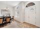 Bright entryway featuring double doors, arch windows, elegant lighting, and wood flooring at 6212 Nimes Ct, Lutz, FL 33558