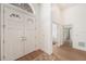 Grand foyer with double doors, high ceilings, and wood floors, leading to various rooms at 6212 Nimes Ct, Lutz, FL 33558