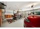 Spacious garage featuring ample storage, shelving, and a modern red car at 6212 Nimes Ct, Lutz, FL 33558
