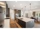 Spacious kitchen with large island, stainless steel appliances, and modern pendant lighting at 6212 Nimes Ct, Lutz, FL 33558