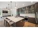 Contemporary kitchen with island, quartz countertops, and open layout to the living area at 6212 Nimes Ct, Lutz, FL 33558