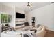 Bright and airy living room with modern fireplace and comfortable seating at 6212 Nimes Ct, Lutz, FL 33558
