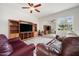 Spacious living room with a large mirror reflecting the furnishings, decor, and natural light at 6212 Nimes Ct, Lutz, FL 33558