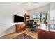Dedicated home office space with a large window, ample desk space, and built-in shelving at 6212 Nimes Ct, Lutz, FL 33558