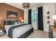Stylish bedroom featuring a sports theme, modern furnishings, and a large window at 6811 Jared Oaks Dr, Wesley Chapel, FL 33545