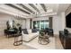 Bright and airy open-concept living room with natural light, stylish decor, and a seamless flow to the outdoors at 6811 Jared Oaks Dr, Wesley Chapel, FL 33545