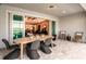 Charming outdoor dining area with views of the kitchen and living room through sliding glass doors at 6811 Jared Oaks Dr, Wesley Chapel, FL 33545