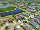Aerial view of the property showcasing its prime location near a lake and lush greenery at 6913 Park Strand Dr, Apollo Beach, FL 33572