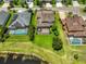 Gorgeous home boasts a screened in lanai and a large back yard with lake access at 6913 Park Strand Dr, Apollo Beach, FL 33572