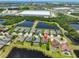 Beautiful aerial view of the home near ponds and community features with easy access to the highway at 6913 Park Strand Dr, Apollo Beach, FL 33572