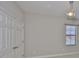 A bedroom featuring a window with blinds and closet at 6913 Park Strand Dr, Apollo Beach, FL 33572