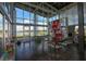 Bright clubhouse interior with floor-to-ceiling windows, tables, and a modern decorative bookshelf at 6913 Park Strand Dr, Apollo Beach, FL 33572