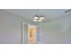 Elegant foyer with French doors leading into a spacious living area with tile flooring and a decorative medallion at 6913 Park Strand Dr, Apollo Beach, FL 33572