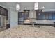 Kitchen features granite countertops, stainless steel appliances, and dark cabinetry at 6913 Park Strand Dr, Apollo Beach, FL 33572
