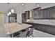 Kitchen features granite countertops, stainless steel appliances, and dark cabinetry at 6913 Park Strand Dr, Apollo Beach, FL 33572