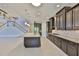 Gourmet kitchen features granite counters, stainless appliances, and access to stairs at 6913 Park Strand Dr, Apollo Beach, FL 33572