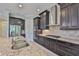 Gourmet kitchen features granite counters, stainless appliances, and gas cooktop at 6913 Park Strand Dr, Apollo Beach, FL 33572