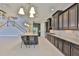 Spacious kitchen with granite counters, stainless appliances, and access to stairs at 6913 Park Strand Dr, Apollo Beach, FL 33572