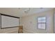 Living room featuring a projector screen and a window at 6913 Park Strand Dr, Apollo Beach, FL 33572
