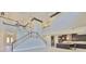 An expansive living area features a grand staircase, an open floor plan, and seamless flow into the kitchen at 6913 Park Strand Dr, Apollo Beach, FL 33572