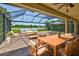 This relaxing outdoor patio with brick pavers and a gazebo provides a comfortable space to unwind with beautiful water views at 6913 Park Strand Dr, Apollo Beach, FL 33572