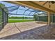 A screened patio with brick pavers features a gazebo and expansive water views, providing a relaxing outdoor living space at 6913 Park Strand Dr, Apollo Beach, FL 33572