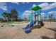Well-maintained playground with slide, climbing structure, and soft ground covering at 6913 Park Strand Dr, Apollo Beach, FL 33572