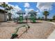 Playground with slides, climbing frames, and shade canopies, set in a wood-chip base at 6913 Park Strand Dr, Apollo Beach, FL 33572
