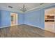 Open-concept room with tile flooring, neutral paint, and a view into the bathroom and kitchen at 6913 Park Strand Dr, Apollo Beach, FL 33572