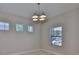 Bright and airy room with multiple windows and modern lighting offering a versatile space for various uses at 6913 Park Strand Dr, Apollo Beach, FL 33572