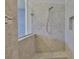 Modern shower with custom tile, a glass enclosure, and convenient built-in niche at 6913 Park Strand Dr, Apollo Beach, FL 33572