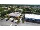 Aerial view of business district surrounded by parking and mature landscaping at 7701 Starkey Rd # 504, Seminole, FL 33777