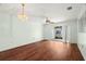 Hardwood floors add elegance to this open-concept living space with balcony access at 7701 Starkey Rd # 504, Seminole, FL 33777