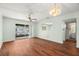 Spacious living room features hardwood floors, a ceiling fan, and sliding glass doors to a patio at 7701 Starkey Rd # 504, Seminole, FL 33777