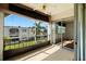 Enclosed patio with sliding glass doors, tile flooring, and a ceiling fan offers relaxing outdoor space at 7701 Starkey Rd # 504, Seminole, FL 33777