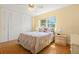 Bedroom with a queen bed, ceiling fan and large window allowing for lots of natural light at 7701 Starkey Rd # 601, Seminole, FL 33777