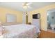 Cozy bedroom featuring a queen bed, ceiling fan, and neutral color scheme at 7701 Starkey Rd # 601, Seminole, FL 33777