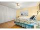 Bedroom with a queen bed, a ceiling fan, and a large closet with mirrored doors at 7701 Starkey Rd # 601, Seminole, FL 33777