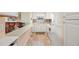 Bright, efficient kitchen with white cabinets, tile backsplash, and modern appliances at 7701 Starkey Rd # 601, Seminole, FL 33777