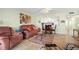 Bright living room and dining area with comfortable furnishings and views into the kitchen at 7701 Starkey Rd # 601, Seminole, FL 33777