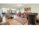 Comfortable living room featuring tile flooring, cozy furniture, and ample natural light at 7701 Starkey Rd # 601, Seminole, FL 33777
