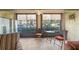 Relaxing sunroom with tile flooring, ceiling fan, and screened windows at 7701 Starkey Rd # 601, Seminole, FL 33777