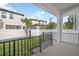 Relaxing covered back porch with a view of the fenced backyard at 7703 S Kissimmee St, Tampa, FL 33616