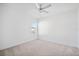 Bright bedroom features neutral carpet, one window, and a ceiling fan at 7703 S Kissimmee St, Tampa, FL 33616