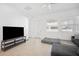 Open living area with tile floors, natural light, and comfortable seating arrangement provides a relaxing atmosphere at 7703 S Kissimmee St, Tampa, FL 33616