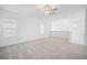 Open loft area with natural light and neutral carpeting, perfect for a flexible living space at 7703 S Kissimmee St, Tampa, FL 33616