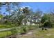 View from the fenced in backyard to the water's edge at 8350 40Th N Ave, St Petersburg, FL 33709