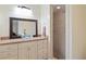Bathroom featuring neutral tones, large mirror, and a glass vessel sink adding style and functionality at 8350 40Th N Ave, St Petersburg, FL 33709