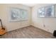 This light-filled bedroom features wood floors and view to the outdoors at 8350 40Th N Ave, St Petersburg, FL 33709